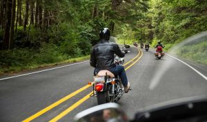 motorcycle group riding through woods gettyimages 680