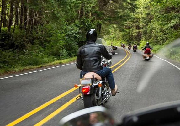 motorcycle-group-riding-through-woods-gettyimages-680